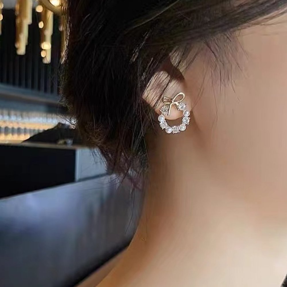Pearl bow stud earrings